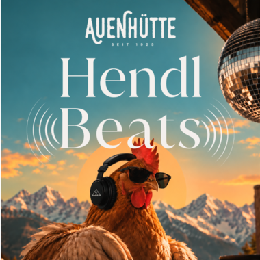 A chicken stands as a DJ with headphones and sunglasses in front of a mixing console. In the background, majestic mountains and a clear sky can be seen.